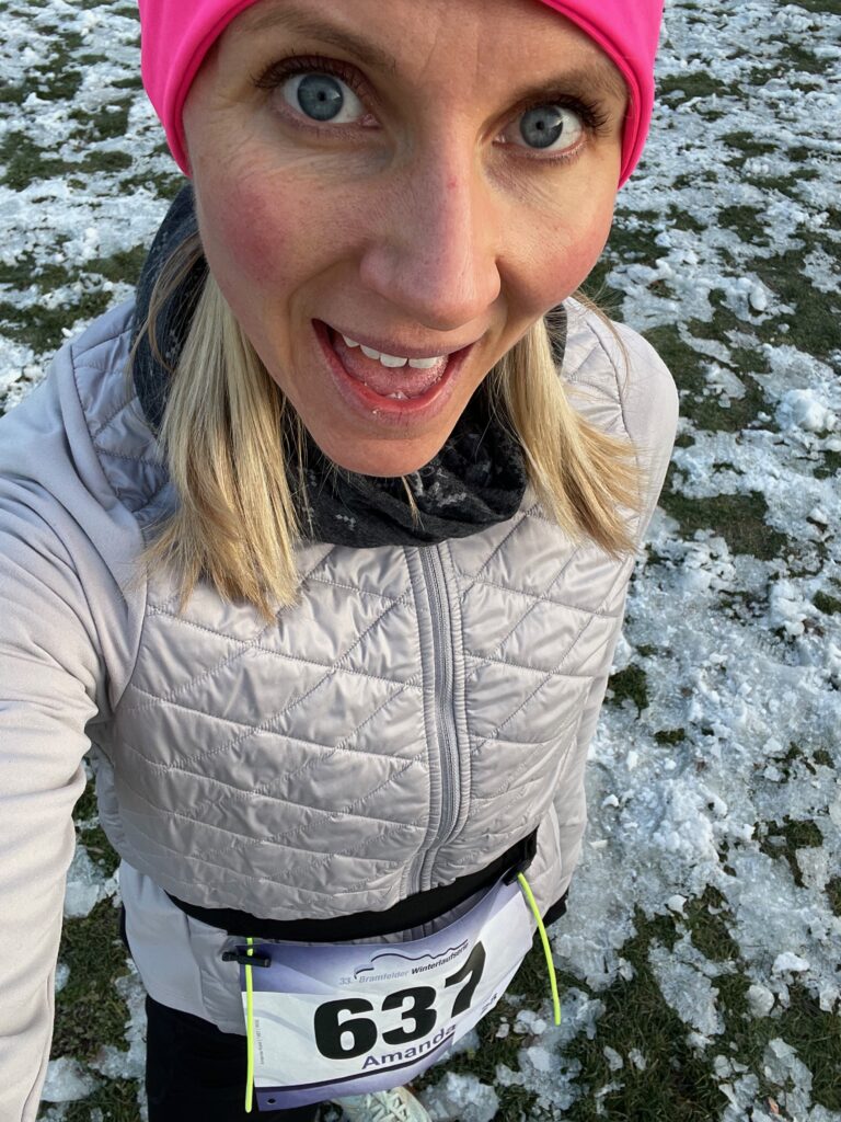 Coach Mandy in a pink beanie at a winter race